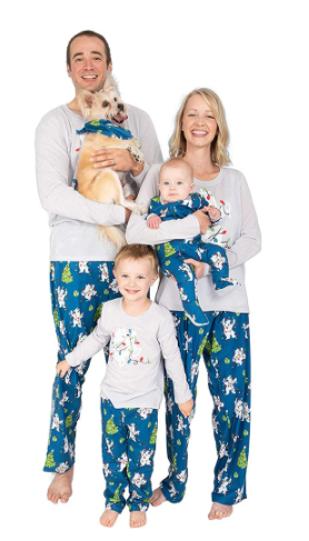 Family of four wearing matching Christmas pajamas with polar bears, string lights, and Christmas trees. - Image 11