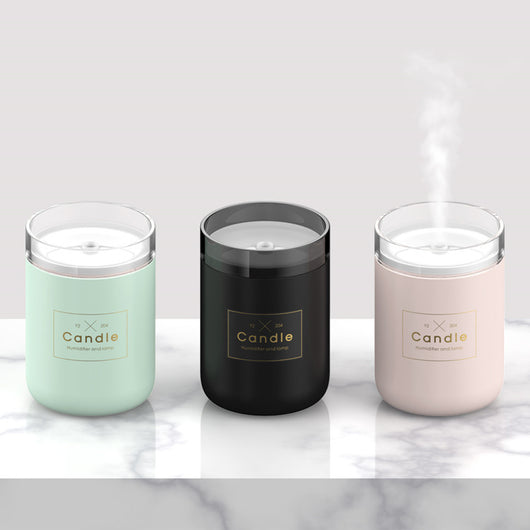 Light pink mini USB humidifier diffuser, shaped like a candle, with a clear top and visible mist output. - Image 5