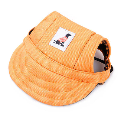 Orange pet baseball cap with ear holes and a curved brim, featuring a small patch with a dog graphic. - Image 9