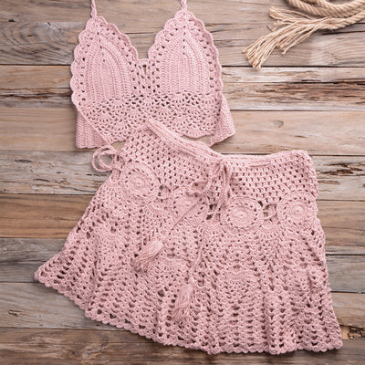 Light beige crochet bikini set with a halter crop top and a matching open-knit mini skirt with tassels. - Image 44