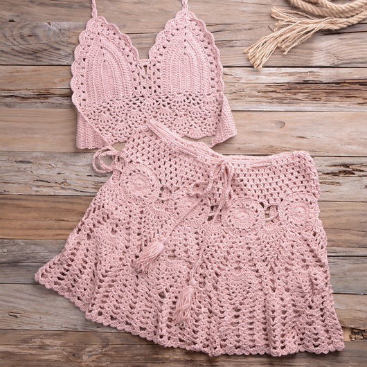 Light beige crochet bikini set with a halter crop top and a matching open-knit mini skirt with tassels. - Image 44