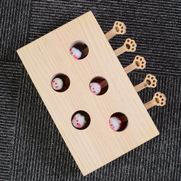 Solid wood whac-a-mole cat toy with 8 holes, featuring small white mouse figures and paw-shaped levers.