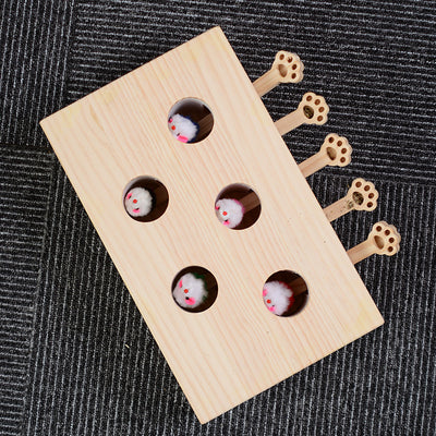 Solid wood whac-a-mole cat toy with 8 holes, featuring small white mouse figures and paw-shaped levers.