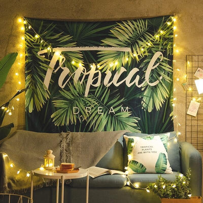Tropical Dream tapestry with green banana leaves on a dark blue background, hanging on a white brick wall. - Image 3