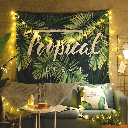 Tropical Dream tapestry with green banana leaves on a dark blue background, hanging on a white brick wall. - Image 3