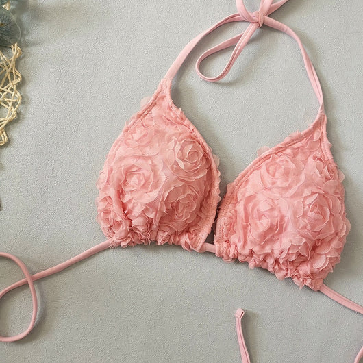 Red three-piece bikini set with a halter top, tie-side thong bottom, and sarong, all featuring a raised floral pattern. - Image 41