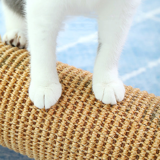 Cat scratcher with a corrugated cardboard cylinder and light wood ends, one shaped like a cat's head. - Image 2