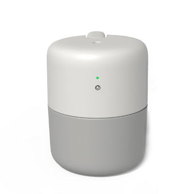 Coral desktop humidifier with a modern cylindrical design, featuring a green indicator light and a power button. - Image 6