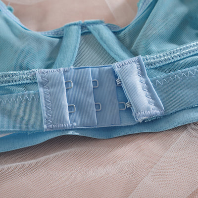 Light blue lace lingerie set with floral details, including a bra, thong, garter belt, choker, and leg chains. - Image 2