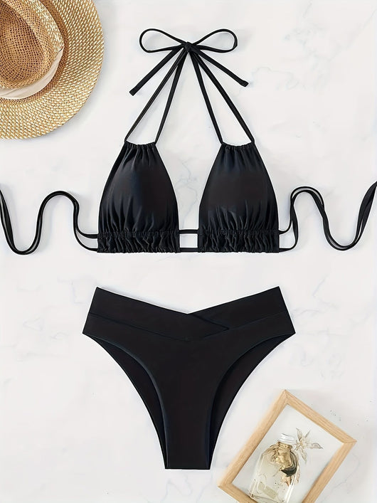Women's black deep V push-up bikini with lace-up back and high-waisted bottom, laid flat on white marble. - Image 10