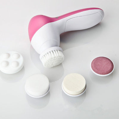 White electric facial cleanser with multiple brush and sponge attachments in an open translucent teal carrying case. - Image 12