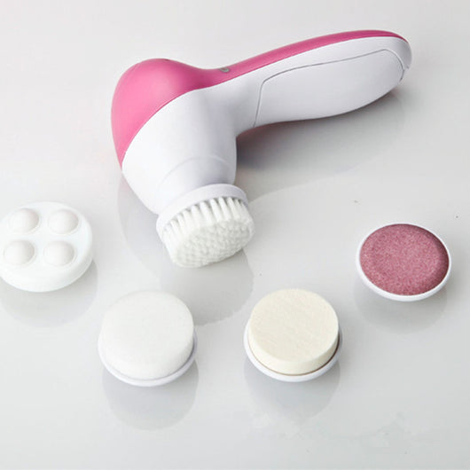White electric facial cleanser with multiple brush and sponge attachments in an open translucent teal carrying case. - Image 12