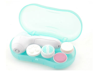 White electric facial cleanser with multiple brush and sponge attachments in an open translucent teal carrying case. - Image 9