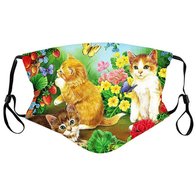 Cotton face mask with a whimsical print of a sleeping cat, a mouse, butterflies, strawberries, and yellow flowers.