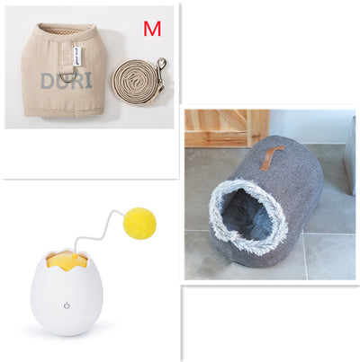 White egg-shaped automatic cat toy with a yellow interior and a flexible wire holding a yellow fuzzy ball. - Image 10