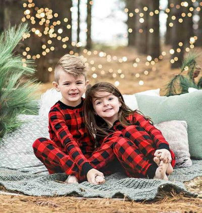 Red and black buffalo plaid baby romper with long sleeves, snap front closure, and black ribbed cuffs and collar. - Image 3