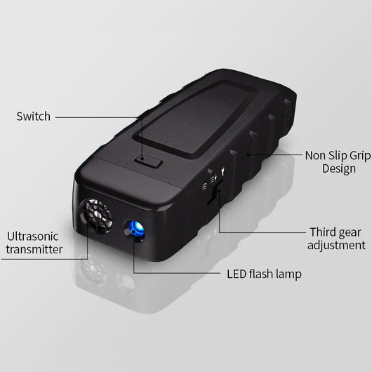 Black and orange handheld ultrasonic dog training device with a Type-C charging port and an orange button. - Image 5