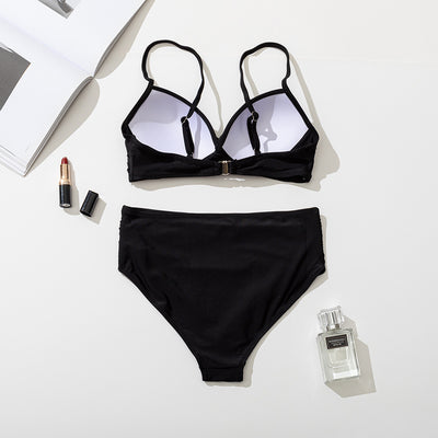 Women's black two-piece bikini with a twisted front bandeau top and high-waisted ruched bottoms. - Image 14