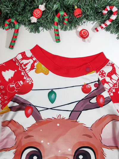 Man wearing a red and white Christmas pajama set with a reindeer graphic and fair isle pattern. - Image 8