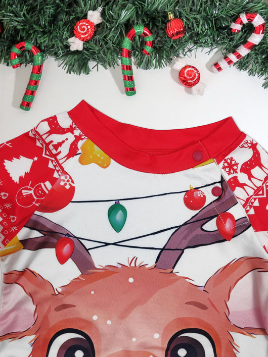 Man wearing a red and white Christmas pajama set with a reindeer graphic and fair isle pattern. - Image 8