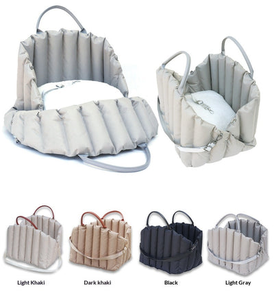 Light khaki quilted portable pet carrier with brown handles and a cream shoulder strap for car travel. - Image 15