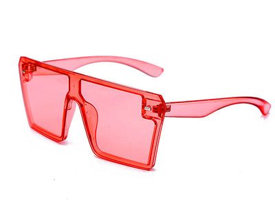 Oversized flat-top sunglasses with translucent red plastic frames and matching red lenses on a white background. - Image 25