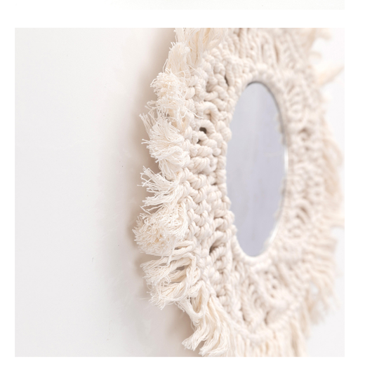 Circular mirror with a beige macrame fringe border, featuring intricate knotwork around the reflective surface. - Image 3