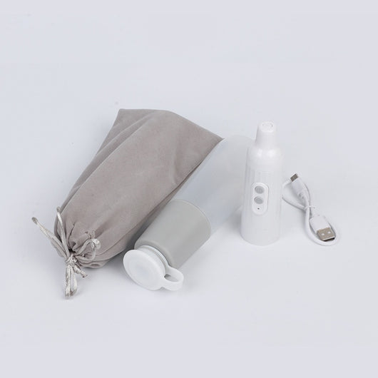 Portable electric bidet with translucent water bottle, white handheld spray unit, USB cable, and grey travel pouch. - Image 4