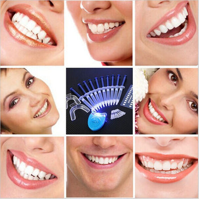 Teeth whitening kit with a blue LED light mouthpiece and a syringe of whitening gel on a white background. - Image 6