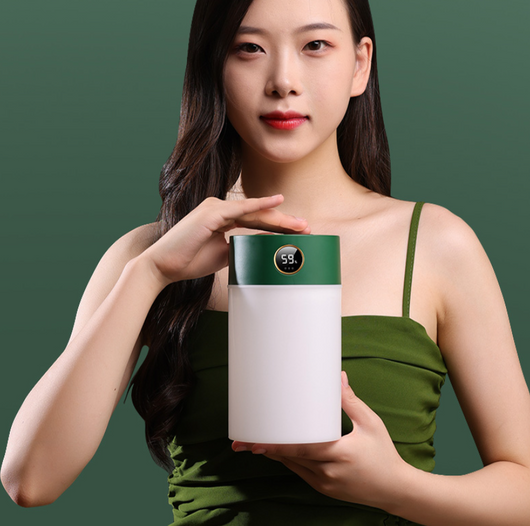 White cylindrical humidifier with a gold nozzle emitting mist, featuring a subtle bear emblem. Includes five aromatherapy oil bottles. - Image 14