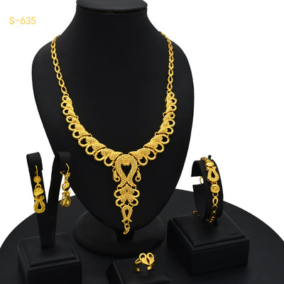 Ornate gold-colored bridal jewelry set with filigree design, including a necklace, drop earrings, bracelet, and ring. - Image 6