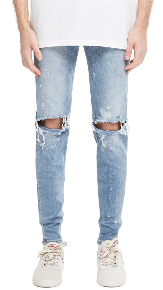 Jeans Slim Fit Azul con Corte en Rodilla y Diseño Spray Pintado - Image 2