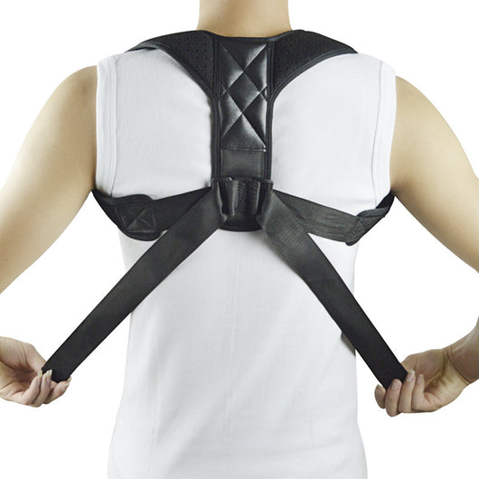 Black back shoulder spine posture corrector worn over a white long-sleeved shirt, showing adjustable straps. (2 pcs) - Image 8