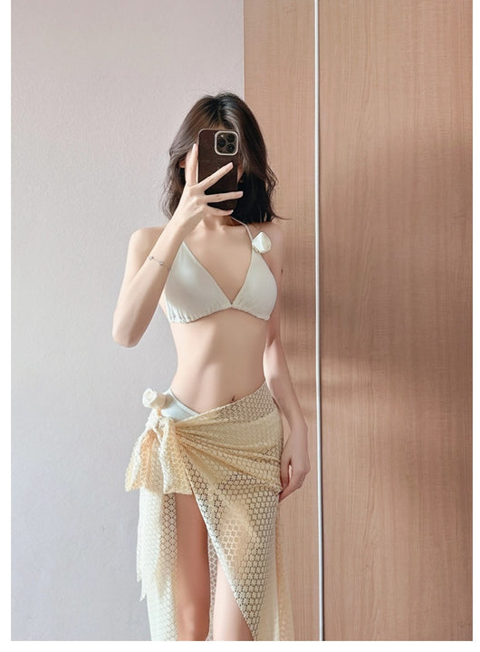 Women's light purple three-piece bikini set with a triangle halter top, bottoms, and a mesh sarong with rose details. - Image 12