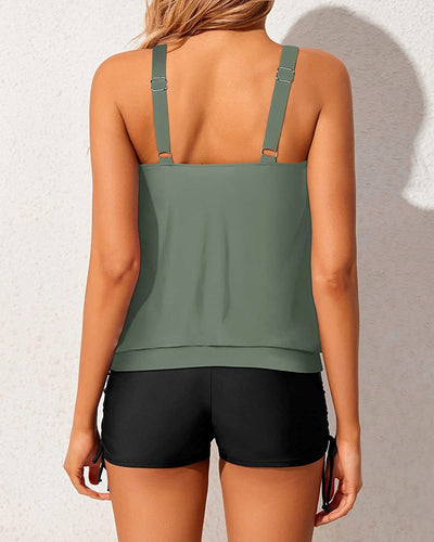 Women's two-piece tankini swimsuit with a colorful abstract print tank top and solid black ruched swim shorts. - Image 27