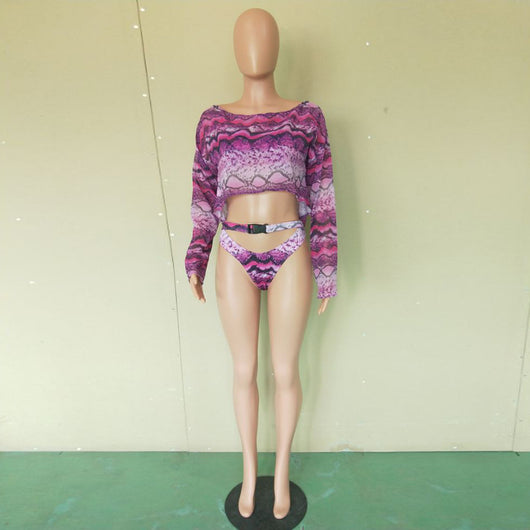 Woman in a purple and pink snakeskin print three-piece swimsuit with an off-shoulder crop top and high-waisted bottoms. - Image 26