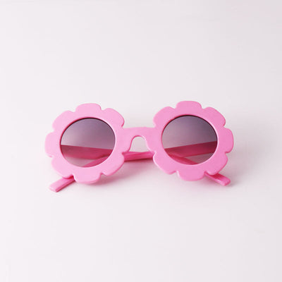 Light blue flower-shaped sunglasses with dark lenses, featuring a playful design and plastic frame. - Image 4