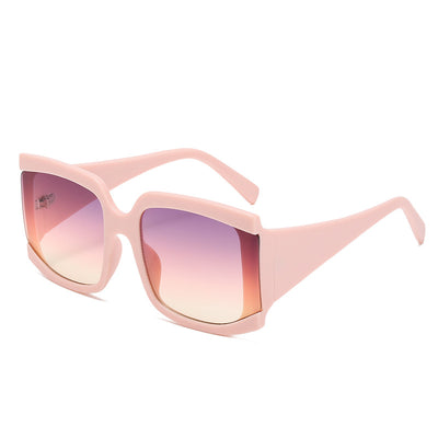 Oversized square-frame sunglasses with a light pink frame and gradient lenses transitioning from purple to orange to yellow. - Image 7