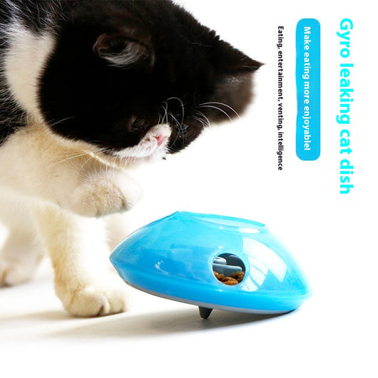Green and white pet toy, a round food dispenser with multiple openings and a central spinning element for cats. - Image 6