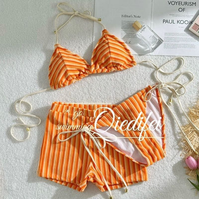 Orange and light orange striped bikini bottom with a ribbed texture and elastic waistband, ideal for beach vacations. - Image 9