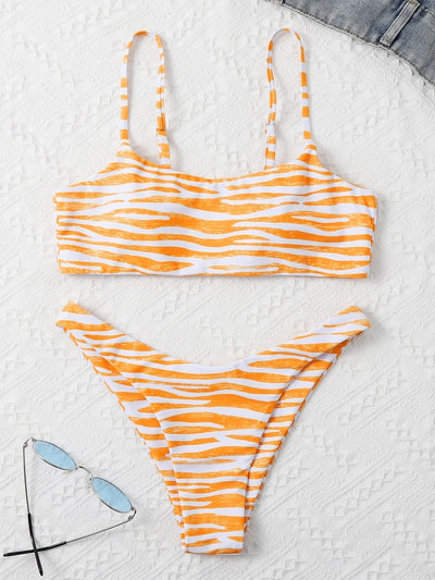 Tan and white zebra stripe two-piece bikini with a bandeau top and high-cut bottom, laid flat. - Image 16