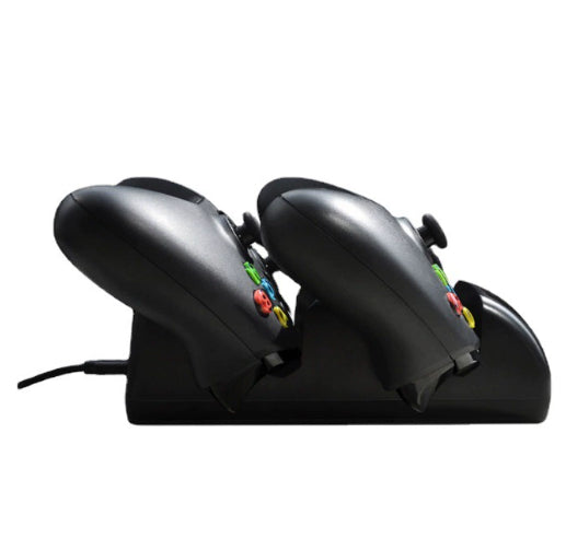 Black dual charging dock for Xbox One wireless controllers with an LED display, shown with two black controllers. - Image 14