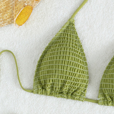 Women's lime green halter bikini with spaghetti straps and thong bottom, modeled outdoors against a blue sky. - Image 4