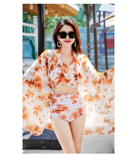 Women's light blue tropical leaf print three-piece swimsuit with short sleeve bikini top, bottoms, and sarong skirt. - Image 41