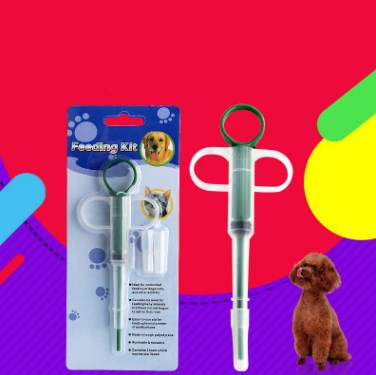 Pet feeding kit with a green syringe-style feeder and two clear teats, packaged for dogs and cats. - Image 3
