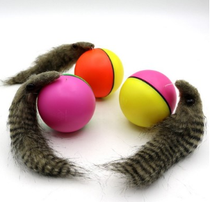 Green and pink two-tone ball with a furry gray beaver-like pet toy on a white background. - Image 2