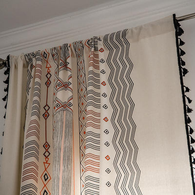Boho cream cotton and linen curtain with tribal print in black and orange, featuring black fringe tassels. - Image 17
