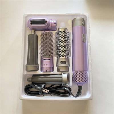 5-in-1 hot air comb hair dryer set with multiple rose red and gray attachments in a white tray. - Image 20
