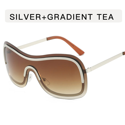 Women's fashionable shield sunglasses with a gold metal frame and dark gray lenses, featuring a unique wavy design. - Image 8