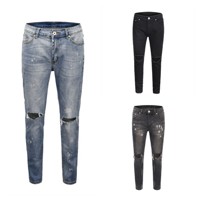 Jeans Slim Fit Azul con Corte en Rodilla y Diseño Spray Pintado